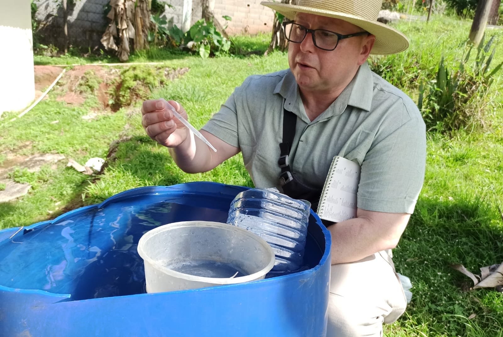 Photo of man collecting sample